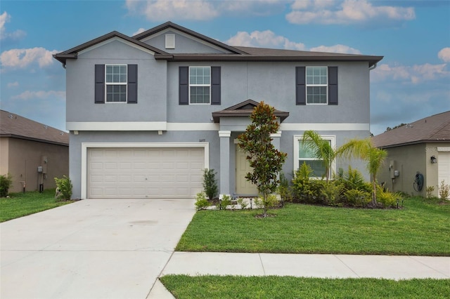 11693 Lavender Loop, Spring Hill, FL 34609 - view of front of property with a garage, stucco siding, driveway, and a front yard