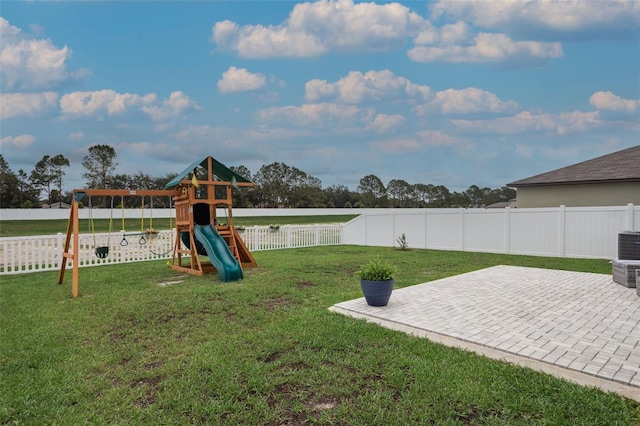 11693 Lavender Loop, Spring Hill, FL 34609 - view of play area featuring a fenced backyard and a patio