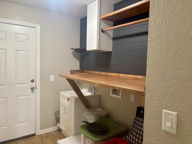 7144 Remington Oaks Loop, Lakeland, FL 33810 - washroom featuring light wood-style floors and hookup for a washing machine