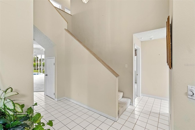 18219 Bittern Ave, Lutz, FL 33558 - stairway with tile patterned flooring and a high ceiling