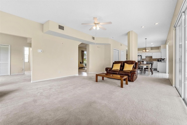 18219 Bittern Ave, Lutz, FL 33558 - living room with light carpet, a ceiling fan, plenty of natural light, and recessed lighting