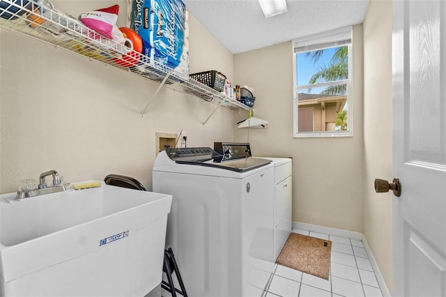 18219 Bittern Ave, Lutz, FL 33558 - laundry room featuring washer and dryer and light tile patterned flooring