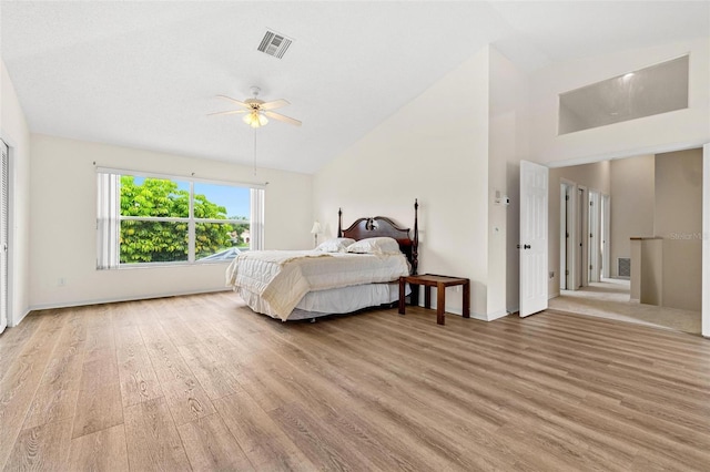 18219 Bittern Ave, Lutz, FL 33558 - bedroom with light wood-style flooring, ceiling fan, and high vaulted ceiling