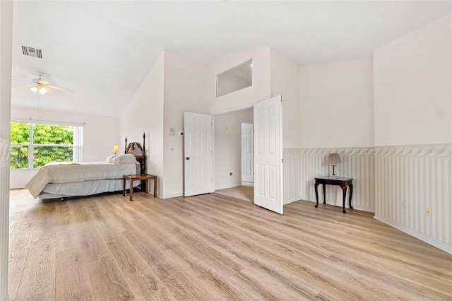 18219 Bittern Ave, Lutz, FL 33558 - bedroom featuring light wood-style floors, vaulted ceiling, and ceiling fan
