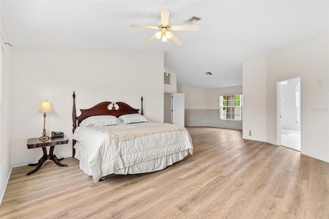 18219 Bittern Ave, Lutz, FL 33558 - bedroom with light wood finished floors, lofted ceiling, and ceiling fan