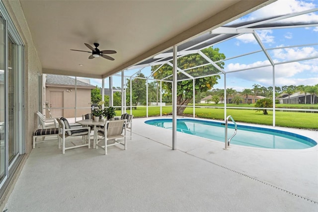 18219 Bittern Ave, Lutz, FL 33558 - outdoor pool with a patio, a yard, ceiling fan, and a lanai