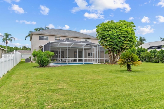 18219 Bittern Ave, Lutz, FL 33558 - rear view of property with stucco siding and a lanai