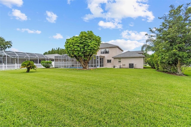 18219 Bittern Ave, Lutz, FL 33558 - view of grassy yard featuring a lanai