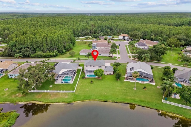 18219 Bittern Ave, Lutz, FL 33558 - aerial view of residential area featuring a heavily wooded area and a nearby body of water