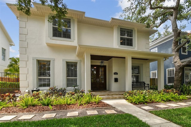 2522 W Watrous Ave, Tampa, FL 33629 - view of front of house with covered porch, stucco siding, and french doors