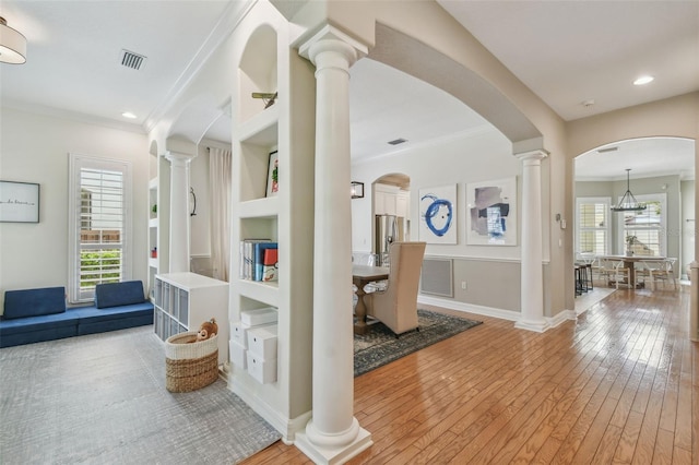 2522 W Watrous Ave, Tampa, FL 33629 - entryway featuring ornamental molding, light wood finished floors, baseboards, arched walkways, and recessed lighting