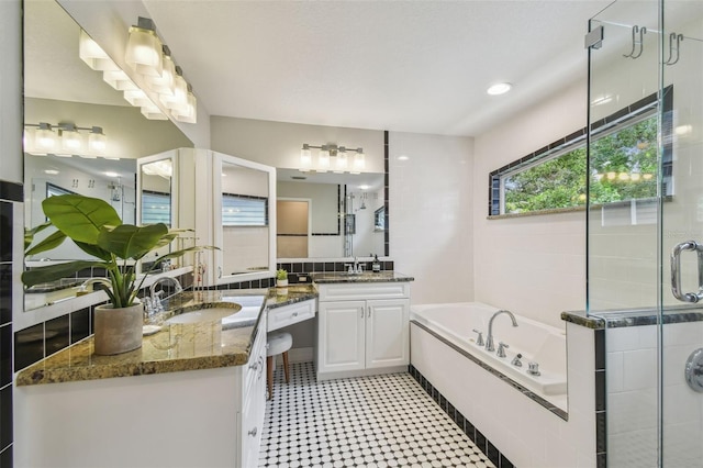 2522 W Watrous Ave, Tampa, FL 33629 - bathroom with a bath, two vanities, tile patterned floors, and a stall shower