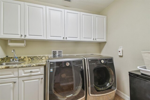2522 W Watrous Ave, Tampa, FL 33629 - laundry room featuring cabinet space, independent washer and dryer, and baseboards