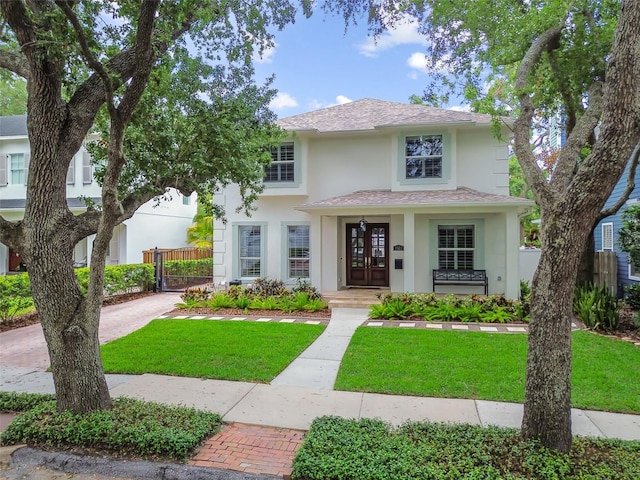 2522 W Watrous Ave, Tampa, FL 33629 - view of front of home with stucco siding, driveway, and a shingled roof