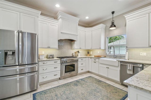 2522 W Watrous Ave, Tampa, FL 33629 - kitchen with stainless steel appliances, a sink, light tile patterned flooring, backsplash, and white cabinetry