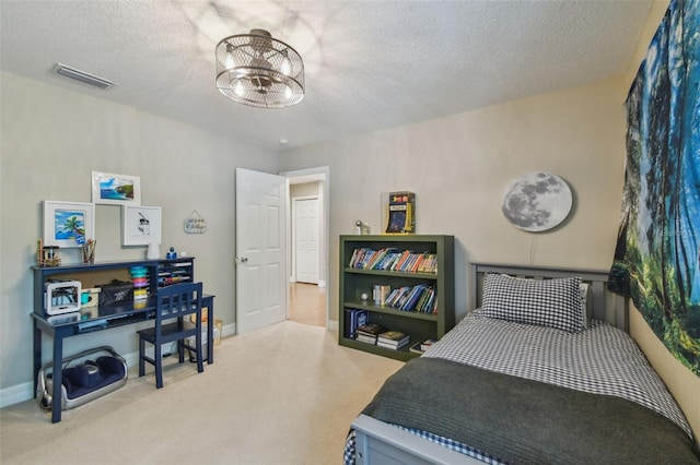 2522 W Watrous Ave, Tampa, FL 33629 - bedroom with carpet flooring, a textured ceiling, baseboards, and a chandelier