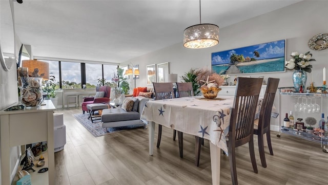 2616 Cove Cay Dr Unit 505, Clearwater, FL 33760 - dining space featuring light wood-style floors and a chandelier