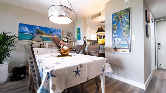 2616 Cove Cay Dr Unit 505, Clearwater, FL 33760 - dining room featuring wood finished floors and baseboards