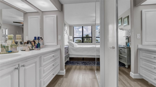 2616 Cove Cay Dr Unit 505, Clearwater, FL 33760 - full bath with vanity, ensuite bathroom, wood finished floors, and a ceiling fan