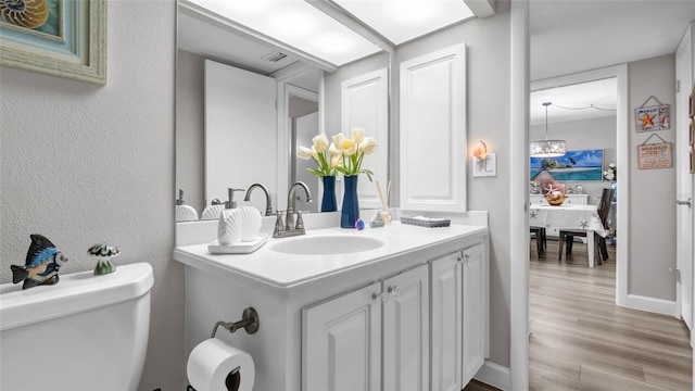 2616 Cove Cay Dr Unit 505, Clearwater, FL 33760 - bathroom with vanity and wood finished floors