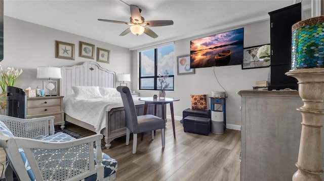 2616 Cove Cay Dr Unit 505, Clearwater, FL 33760 - bedroom featuring wood finished floors and a ceiling fan