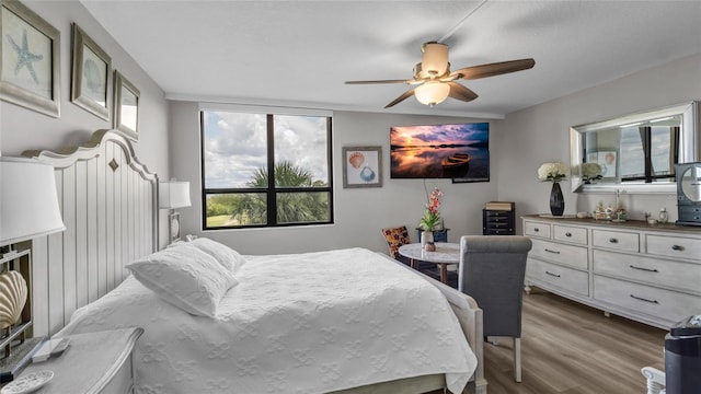 2616 Cove Cay Dr Unit 505, Clearwater, FL 33760 - bedroom featuring dark wood-style flooring and ceiling fan