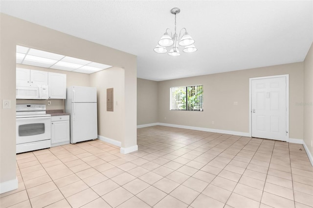 11805 Raintree Lake Ln Unit A, Tampa, FL 33617 - kitchen with white appliances, a chandelier, white cabinetry, decorative light fixtures, and baseboards