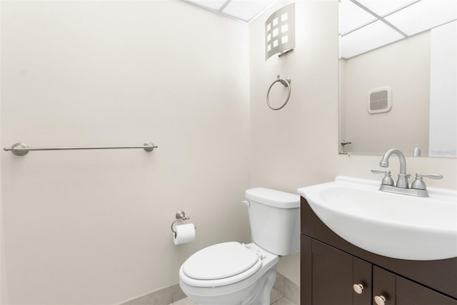 11805 Raintree Lake Ln Unit A, Tampa, FL 33617 - bathroom featuring vanity, toilet, baseboards, and tile patterned flooring