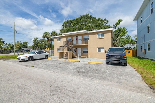 1799 Russell St S, Saint Petersburg, FL 33712 - view of building exterior with uncovered parking and stairs