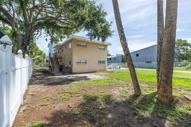 1799 Russell St S, Saint Petersburg, FL 33712 - rear view of house featuring stairway