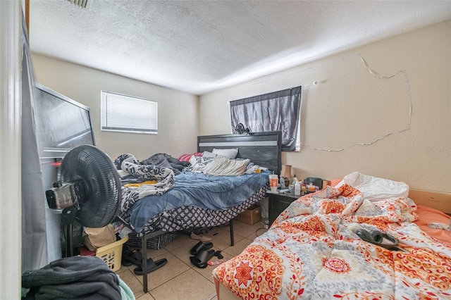 1799 Russell St S, Saint Petersburg, FL 33712 - bedroom featuring tile patterned floors and a textured ceiling