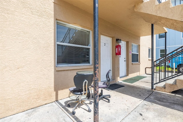 1799 Russell St S, Saint Petersburg, FL 33712 - doorway to property featuring stucco siding