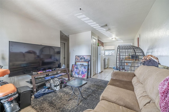 1799 Russell St S, Saint Petersburg, FL 33712 - living area with tile patterned flooring and a textured ceiling