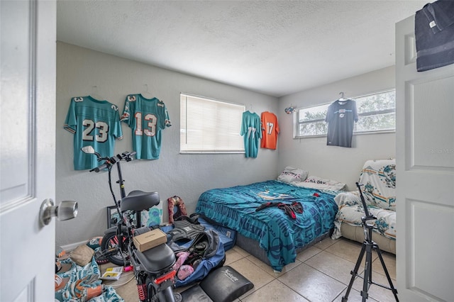 1799 Russell St S, Saint Petersburg, FL 33712 - tiled bedroom with a textured ceiling