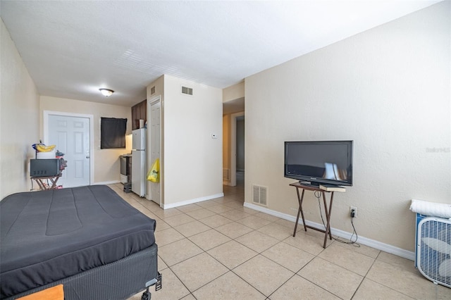 1799 Russell St S, Saint Petersburg, FL 33712 - bedroom featuring freestanding refrigerator and light tile patterned floors