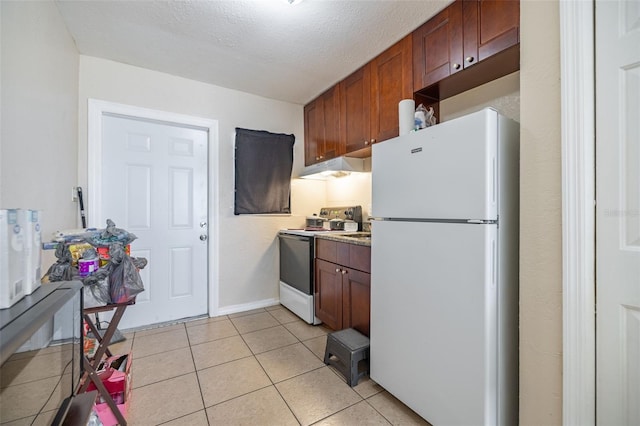 1799 Russell St S, Saint Petersburg, FL 33712 - kitchen featuring white appliances, under cabinet range hood, light tile patterned flooring, and light countertops
