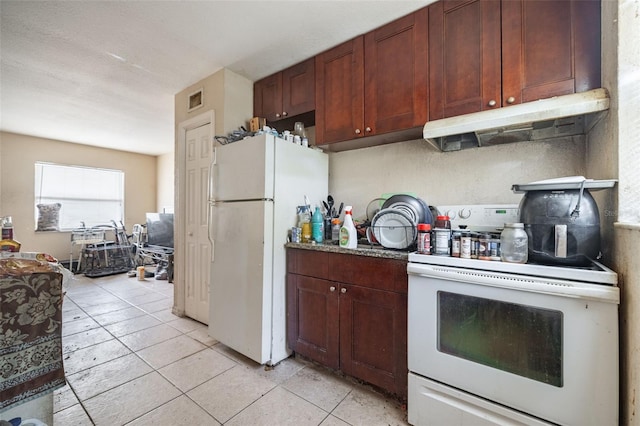 1799 Russell St S, Saint Petersburg, FL 33712 - kitchen with white appliances, under cabinet range hood, and light tile patterned floors