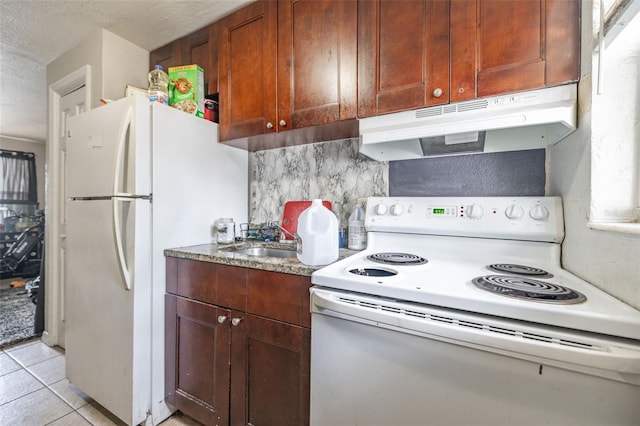 1799 Russell St S, Saint Petersburg, FL 33712 - kitchen with white appliances, under cabinet range hood, a textured ceiling, light tile patterned floors, and light stone counters