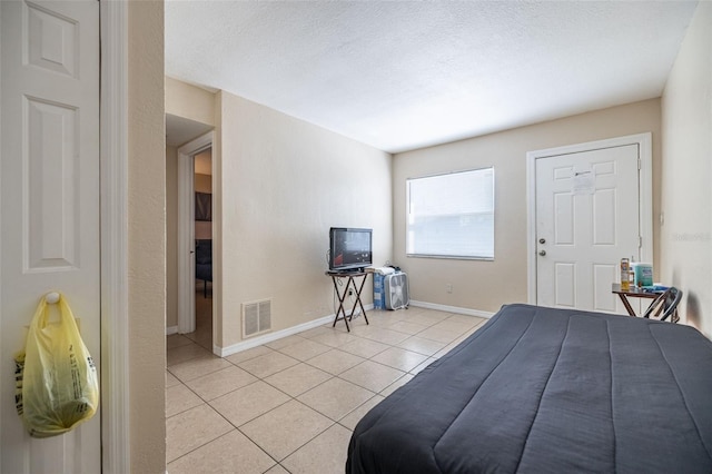 1799 Russell St S, Saint Petersburg, FL 33712 - bedroom featuring light tile patterned floors and a textured ceiling
