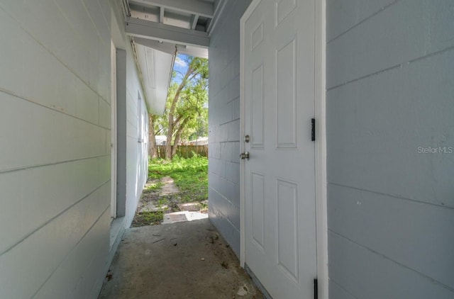 1807 E Bougainvillea Ave, Tampa, FL 33612 - exterior space featuring concrete block wall and concrete flooring