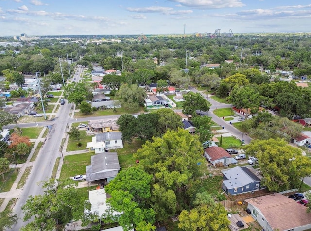 1807 E Bougainvillea Ave, Tampa, FL 33612 - aerial view of property's location featuring nearby suburban area and a tree filled landscape