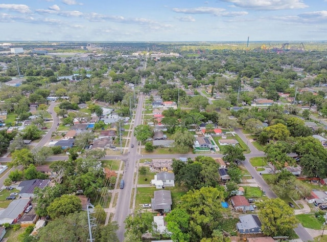 1807 E Bougainvillea Ave, Tampa, FL 33612 - aerial view of property and surrounding area featuring nearby suburban area