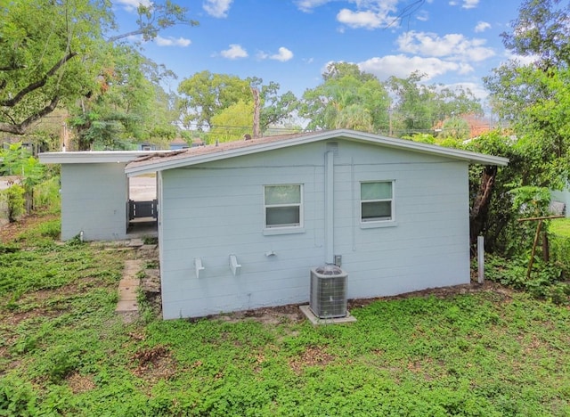 1807 E Bougainvillea Ave, Tampa, FL 33612 - view of home's exterior with a central air condition unit