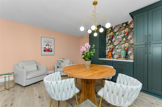 1558 Cottonwood Ter, Dunedin, FL 34698 - dining space featuring light wood-type flooring, baseboards, and a chandelier