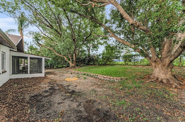 1558 Cottonwood Ter, Dunedin, FL 34698 - view of yard featuring a sunroom