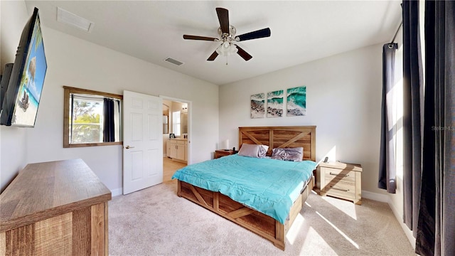 5645 Del Coronado Dr, Apollo Beach, FL 33572 - bedroom with light carpet, ensuite bath, and baseboards