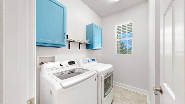 5645 Del Coronado Dr, Apollo Beach, FL 33572 - washroom featuring cabinet space, washer and clothes dryer, and baseboards