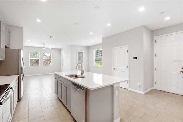 6711 Rocky Park St, Tampa, FL 33625 - kitchen with appliances with stainless steel finishes, gray cabinets, a sink, light tile patterned floors, and recessed lighting