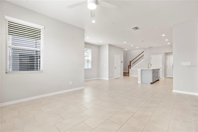 6711 Rocky Park St, Tampa, FL 33625 - unfurnished living room with a ceiling fan, recessed lighting, light tile patterned flooring, and baseboards