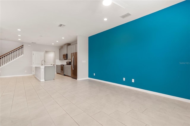 6711 Rocky Park St, Tampa, FL 33625 - unfurnished living room with recessed lighting, ceiling fan, stairs, baseboards, and light tile patterned floors